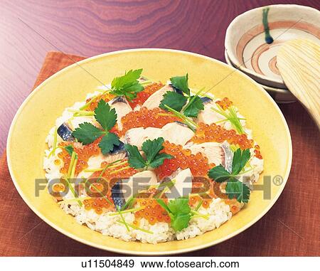 Stock Photo - Vinegared rice with thin strips of egg, Pieces of raw fish, vegetables and crab meat arranged on top, High Angle View. Fotosearch