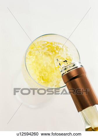 Stock Image - Poured White Wine, High Angle View. Fotosearch