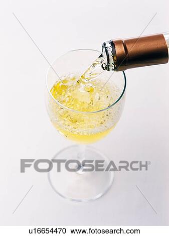Stock Image - Poured White Wine, High Angle View. Fotosearch