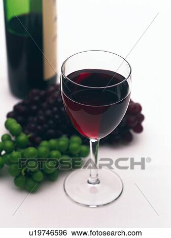 Stock Photograph - Red Wine and Grape and Bottle Wine, High Angle View. Fotosearch