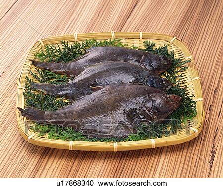 Flounders on bamboo basket, high angle view View Large Photo Image Stock Image - Flounders on bamboo basket, high angle view. Fotosearch