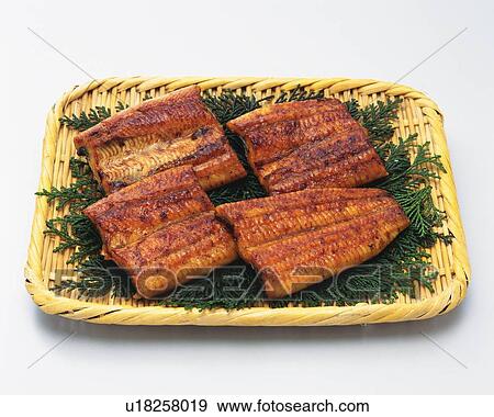 Stock Photo - Grilled eels, high angle view. Fotosearch
