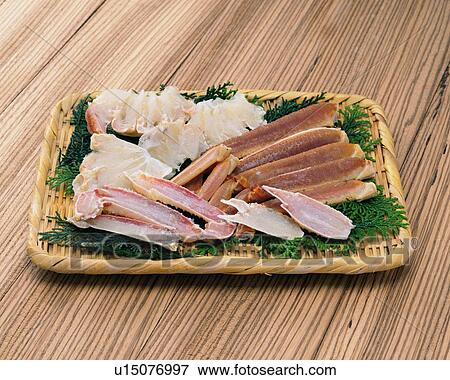 Stock Photo - Legs of crab on bamboo basket, high angle view. Fotosearch