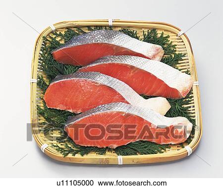 Salmon fillets on bamboo basket, high angle view View Large Photo Image Stock Image - Salmon fillets on bamboo basket, high angle view. Fotosearch