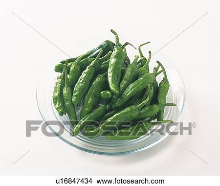 Green chilli peppers on plate, high angle view View Large Photo Image Picture - Green chilli peppers on plate, high angle view. Fotosearch