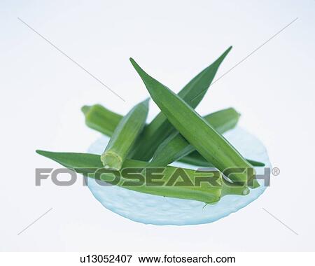 Stock Photo - Okras on plate, high angle view . Fotosearch