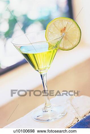 Stock Photo - Lemon Wedge, Liquid, Glass, Martini Glass, Indoor, Food And Drink. Fotosearch