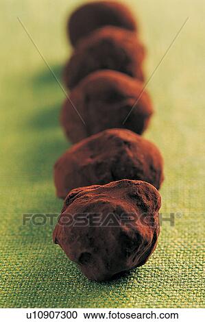Stock Image - Brown, Chocolate Ball, Close-Up, Dessert, Focus On Foreground. Fotosearch