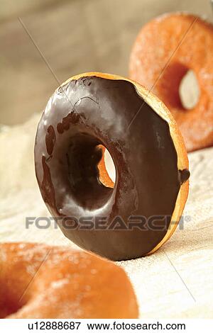 Chocolate donuts View Large Photo Image Stock Photo - Chocolate donuts. Fotosearch