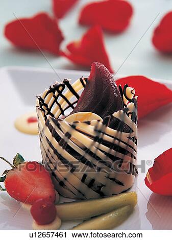 Stock Image - Chocolate Pastry, Close-Up, Dessert, Focus On Foreground, Fruit. Fotosearch