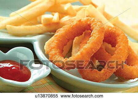 Stock Photography - Onion rings and fries . Fotosearch