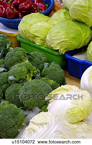A variety of fresh vegetables in tubs and on the floor, on display in a market stall View Large Photo Image Stock Image - A variety of fresh vegetables in tubs and on the floor, on display in a market stall. Fotosearch