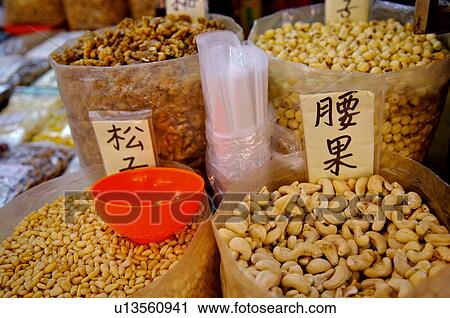 A variety of nuts, including peanuts, walnuts, and cashew nuts, on display in large plastic bags View Large Photo Image Stock Image - A variety of nuts, including peanuts, walnuts, and cashew nuts, on display in large plastic bags. Fotosearch