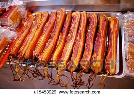 Cured pork in a row, on a tray, on display View Large Photo Image Stock Photo - Cured pork in a row, on a tray, on display. Fotosearch