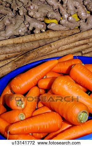 Fresh carrots, ginger, and burdocks on display at a market stall View Large Photo Image Stock Image - Fresh carrots, ginger, and burdocks on display at a market stall. Fotosearch