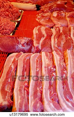 Fresh pork on display at a stall in a market View Large Photo Image Stock Photography - Fresh pork on display at a stall in a market. Fotosearch