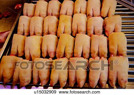 Stock Photo - Fresh pork shanks on display in a market stall. Fotosearch