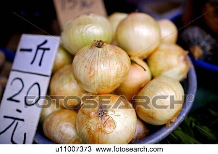 Onions on display on a plastic tray, with the price written on a piece of cardboard View Large Photo Image Stock Image - Onions on display on a plastic tray, with the price written on a piece of cardboard. Fotosearch