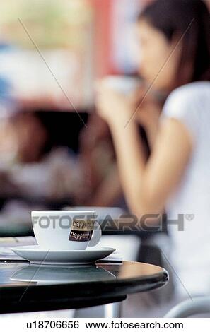 Stock Photograph - one person, drinking, human fingers, drink, cafe, cup, enjoying. Fotosearch