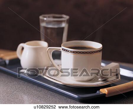 Stock Image - refreshment, plate, glass, china, kettle, spoon. Fotosearch