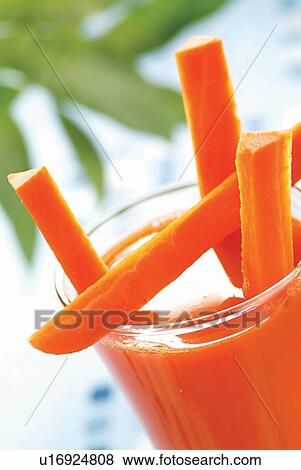 Stock Photo - Carrot, Carrot Juice, Close-Up, Day, Focus On Foreground. Fotosearch