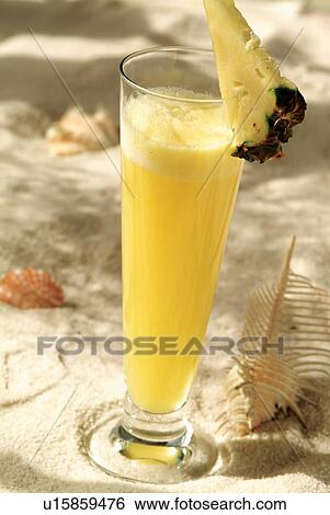 Stock Photograph - Glass, Tropical Fruit, Close-Up, Tropical Drink, Juice, Pineapple, Health. Fotosearch