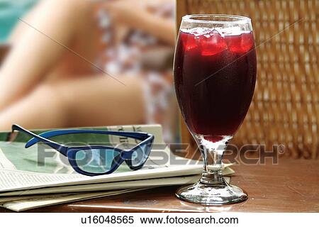 Stock Photography - Sitting, Health, Ice Cube, Newspaper, Close-Up, Freshness. Fotosearch
