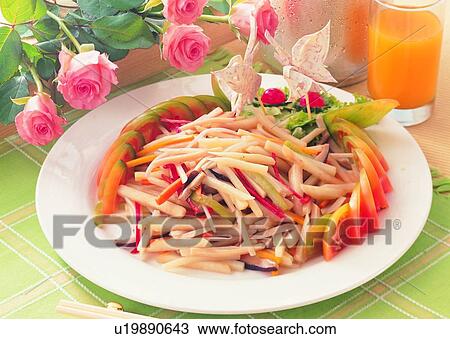 Stock Image - food, fried bamboo shoot, tomato, plate, chopsticks, orange juice. Fotosearch