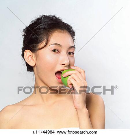 Asian Ethnicity, Close-Up, Black Hair, Apple View Large Photo Image Picture - Asian Ethnicity, Close-Up, Black Hair, Apple. Fotosearch