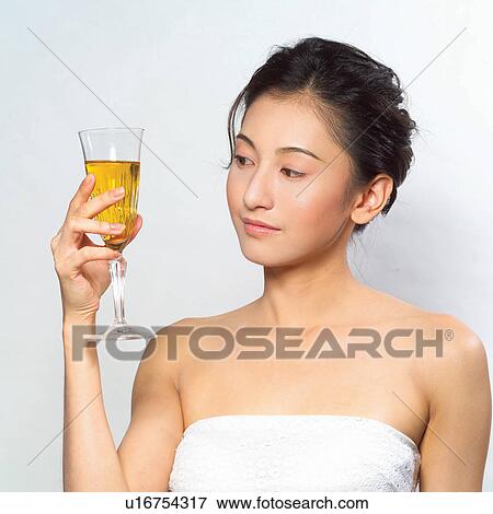 Stock Photo - Asian Ethnicity, Close-Up, Black Hair, Alcohol. Fotosearch