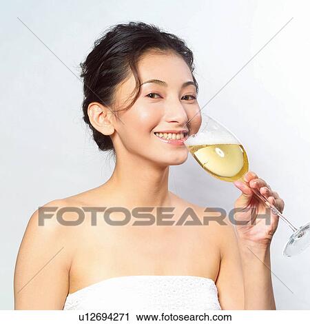Stock Image - Asian Ethnicity, Close-Up, Cheerful, Black Hair, Alcohol. Fotosearch