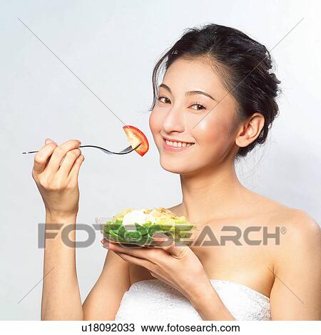 Stock Image - Black Hair, Close-Up, Cheerful, Bowl, Asian Ethnicity. Fotosearch