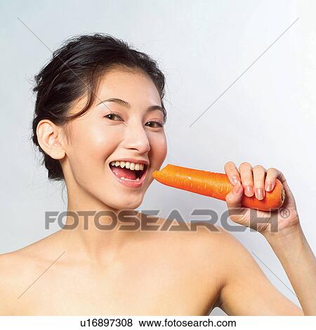 Black Hair, Close-Up, Cheerful, Carrot, Asian Ethnicity View Large Photo Image Stock Photo - Black Hair, Close-Up, Cheerful, Carrot, Asian Ethnicity. Fotosearch