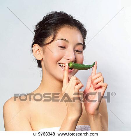 Stock Photo - Black Hair, Youth Culture, Healthy Lifestyle, Holding, Human Face, Vegetable. Fotosearch