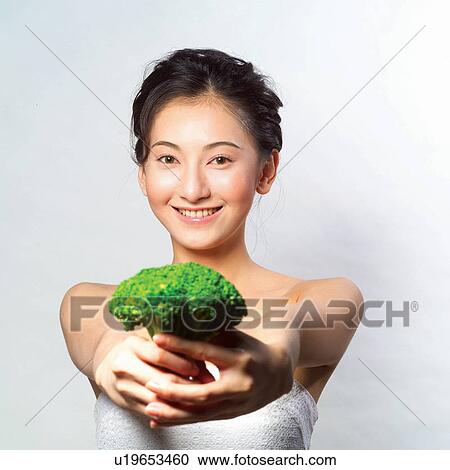 Broccoli, Food And Drink, Looking At Camera, Holding, Tube Top, Human Face View Large Photo Image Stock Image - Broccoli, Food And Drink, Looking At Camera, Holding, Tube Top, Human Face. Fotosearch