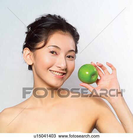 Stock Image - Hair Back, Asian Ethnicity, Cheerful, Beauty, Close-Up. Fotosearch