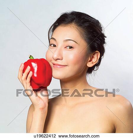 Stock Image - Health & Beauty, One Person, Red, Looking At Camera, Black Hair, Lifestyles. Fotosearch