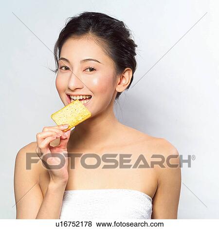 Stock Photo - Healthy Eating, Eating, Toothy Smile, Snack, Asian Ethnicity. Fotosearch