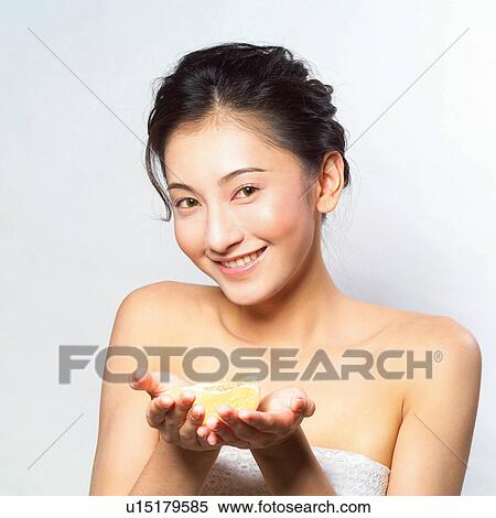 Stock Photography - Healthy Eating, Young Adult, Indoor, White Background, Head And Shoulders, Lifestyles. Fotosearch