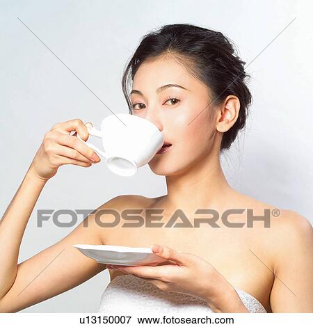 Holding, Drinking, Looking At Camera, Healthy Lifestyle, Square View Large Photo Image Stock Photo - Holding, Drinking, Looking At Camera, Healthy Lifestyle, Square. Fotosearch