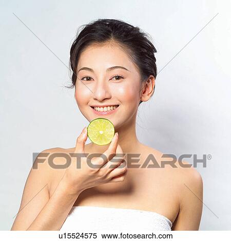 Stock Photography - Lemon, Looking At Camera, White Background, Toothy Smile, Hair Back, Asian Ethnicity. Fotosearch