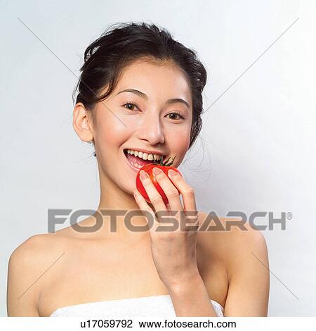 Stock Image - Lifestyles, Youth Culture, Tomato, Indoor, Healthy Eating. Fotosearch
