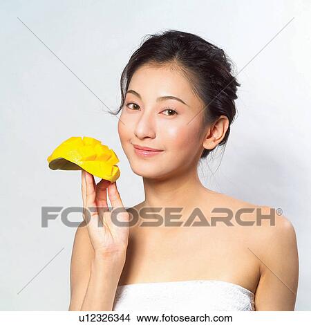 Looking At Camera, Indoor, Close-Up, Dieting, Young Adult, Refreshment View Large Photo Image Picture - Looking At Camera, Indoor, Close-Up, Dieting, Young Adult, Refreshment. Fotosearch