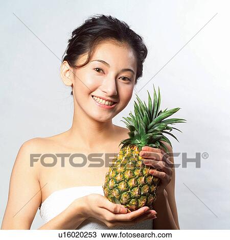 Stock Image - One Person, Dieting, Pineapple, Indoor, Lifestyles, Fruit, Freshness. Fotosearch