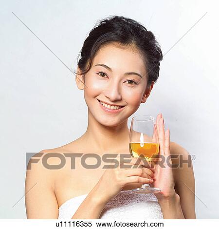 Stock Photography - Portrait, Alcohol, Asian Ethnicity, Holding, Drink, Wine. Fotosearch