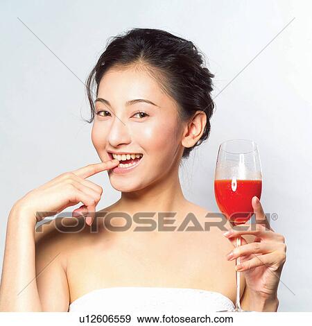 Stock Photo - White Background, Glass, Stem Glass, Human Face, One Young Woman Only, Healthy Lifestyle. Fotosearch