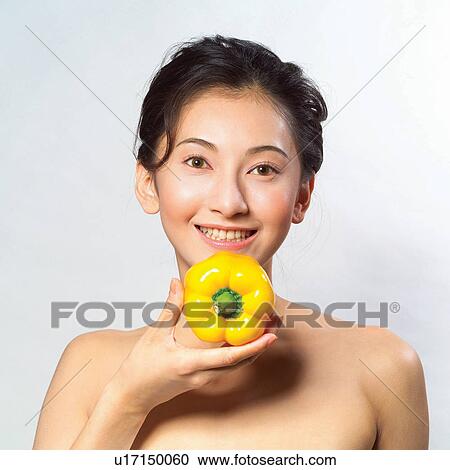Young Adult, Asian Ethnicity, Human Face, Yellow Bell Pepper, Health & Beauty View Large Photo Image Stock Image - Young Adult, Asian Ethnicity, Human Face, Yellow Bell Pepper, Health & Beauty. Fotosearch