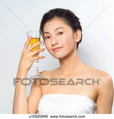 Stock Photograph - Youth Culture, Black Hair, Food And Drink, Looking At Camera. Fotosearch