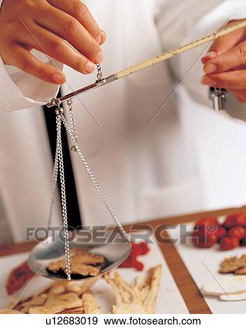 Stock Photo - alternative medicine, curative, balance scale, aid. Fotosearch