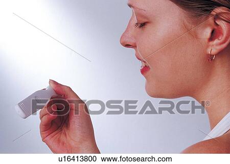 one person, holding, indoor, young woman, expression, emotion, human hand View Large Photo Image Stock Image - one person, holding, indoor, young woman, expression, emotion, human hand. Fotosearch
